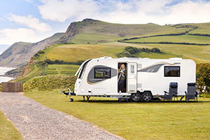 Bailey caravan on a field near cliffs at a holiday park 