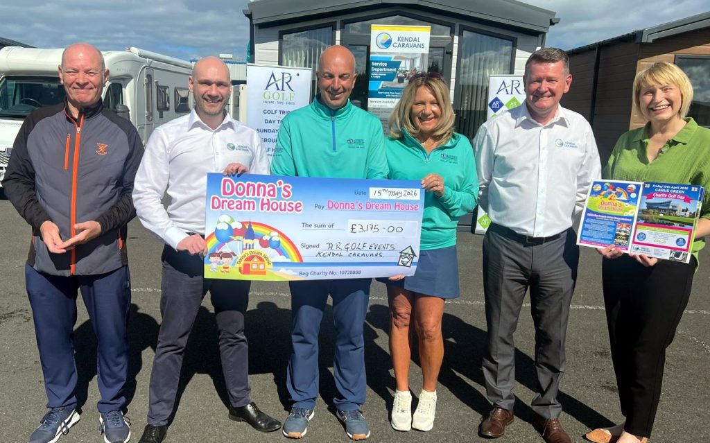 A group photo of charity golfers